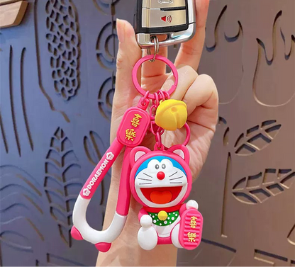 Doraemon Keychains - Cute Pink, Purple & Green Designs with Gold Coins for Bags and Keys