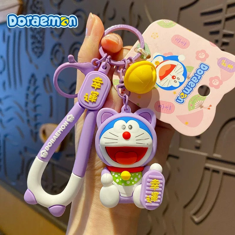 Doraemon Keychains - Cute Pink, Purple & Green Designs with Gold Coins for Bags and Keys