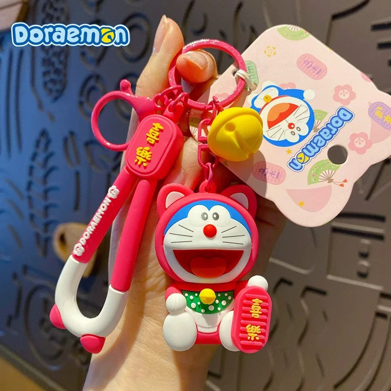 Doraemon Keychains - Cute Pink, Purple & Green Designs with Gold Coins for Bags and Keys