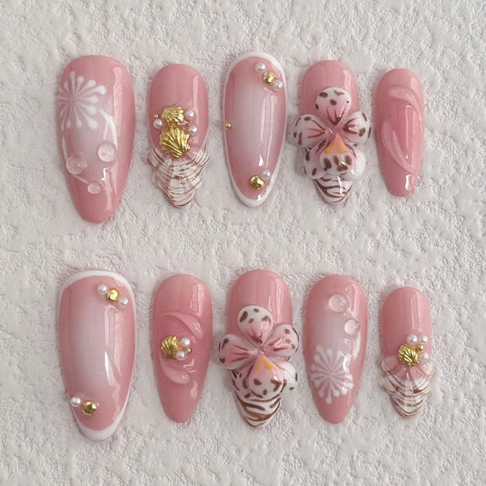 Uñas postizas con diseño de flores rosas