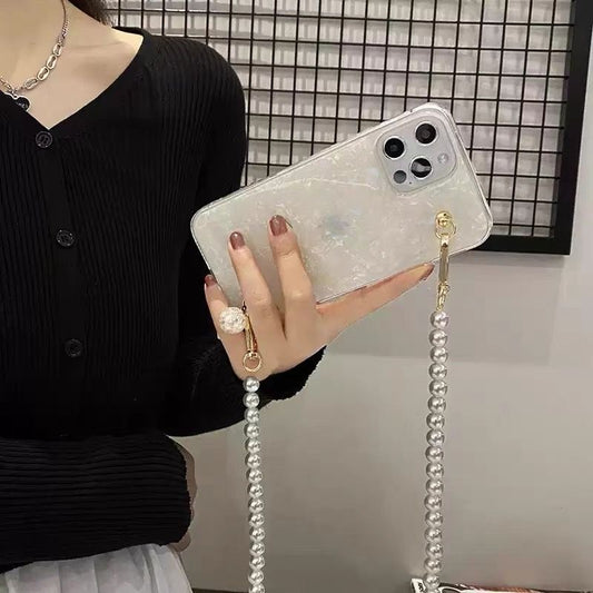 Funda glamurosa para teléfono con forma de concha y cordón cruzado de perlas