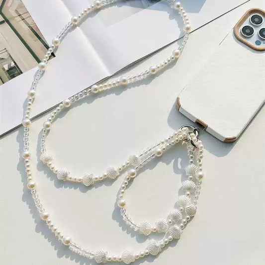 Elegante cordón para teléfono cruzado con conchas y perlas