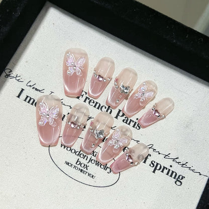 Uñas postizas con diseño de mariposa rosa