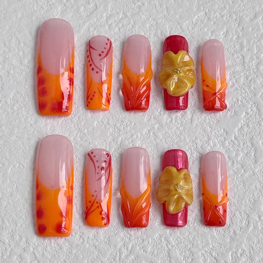 Uñas postizas con diseño floral vintage en color naranja