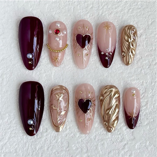 Uñas postizas con corazones carmesí